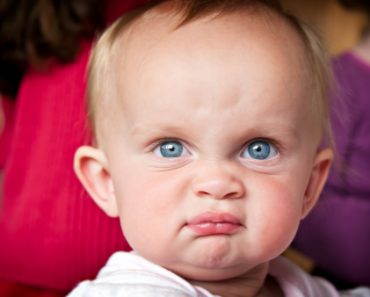 Baby girl with an angry face